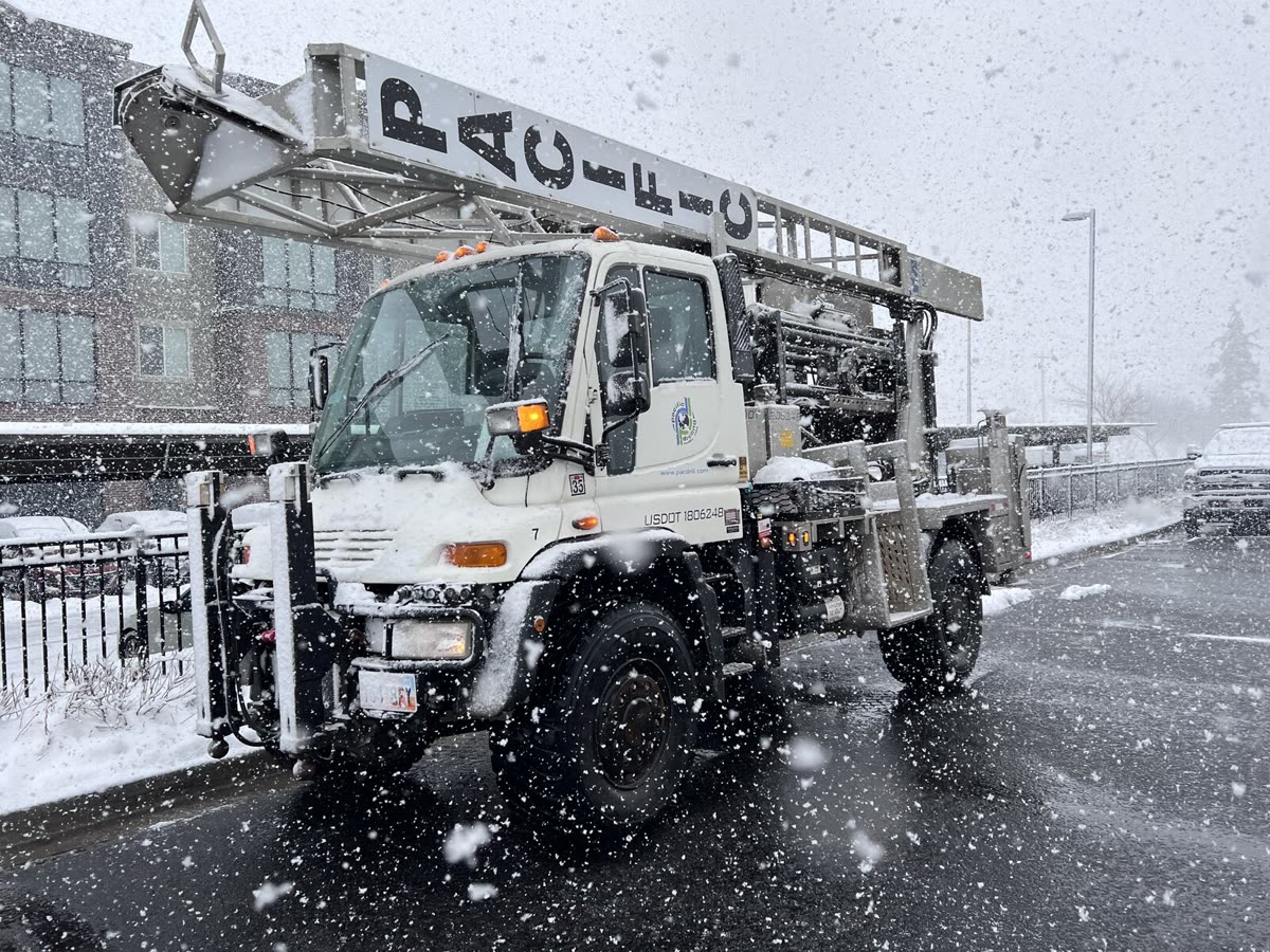 The Wolverine M5 truck rig working through falling snow.